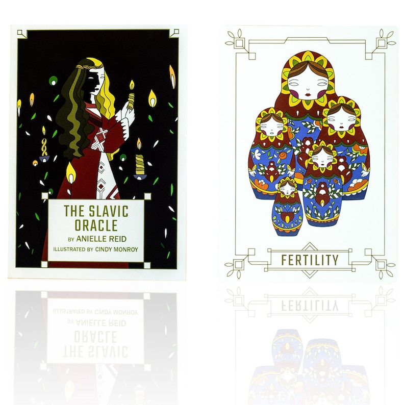 Bright blue, red, green and yellow Matryoshka dolls, Russian nesting dolls are on a card labeled Fertility next to the guidebook of The Slavic Oracle.