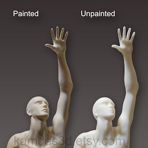 May include: Two human-like figures with one arm raised upward. The left figure is labeled Painted and has a tan skin tone, while the right figure is labeled Unpainted and has a smooth, off-white finish. Both figures feature detailed facial features.