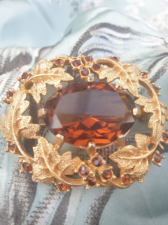 Sarah Coventry Gold Tone Brooch with Amber Rhinestones