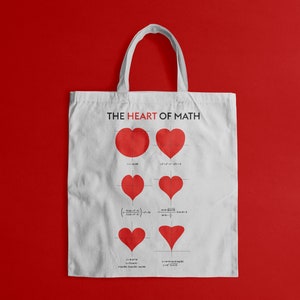 May include: White canvas tote bag with the text "THE HEART OF MATH" printed in black. The bag features a series of red hearts with mathematical equations underneath each heart.