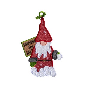 May include: Red and white gnome holding a snowball with a sign that says "Snowballs for Sale".