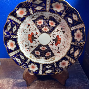 May include: A handmade wooden sign with the text "Welcome to our home" in a handwritten style. The sign is painted white with black lettering and a distressed finish, suitable for indoor or outdoor use.