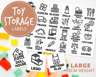 May include: A set of 18 black and white toy storage labels with various icons and text. The labels are designed for large containers, measuring 15 cm in height. The labels include categories such as puzzles, blocks, dolls, musical toys, kitchen, trucks, trains, planes, farm animals, balls, dinosaurs, books, play dough, wooden toys, costumes, arts and craft, pencils, doll house, baby toys, gaming, and pretend play.