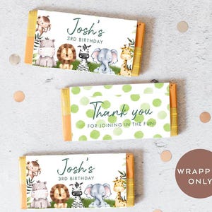 May include: Three chocolate bar wrappers with a jungle animal theme. The wrappers feature a green and white polka dot pattern, a giraffe, a zebra, a lion, an elephant, and the text "Josh's 3rd Birthday" and "Thank you for joining in the fun!"