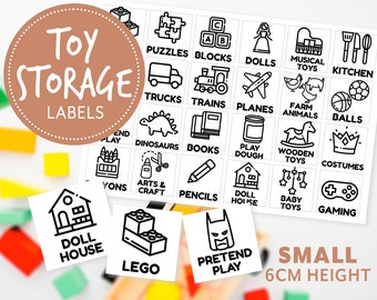 May include: Black and white printable labels for toy storage bins. The labels feature various icons and text, such as "Puzzles", "Blocks", "Dolls", "Musical Toys", "Kitchen", "Trucks", "Trains", "Planes", "Farm Animals", "Balls", "Dinosaurs", "Books", "Play Dough", "Wooden Toys", "Costumes", "Arts & Craft", "Pencils", "Doll House", "Baby Toys", "Gaming", "Lego", "Pretend Play". The labels are 6 cm high.