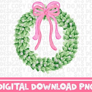 May include: A green watercolor wreath with white berries and a pink bow. The wreath is a traditional Christmas decoration.