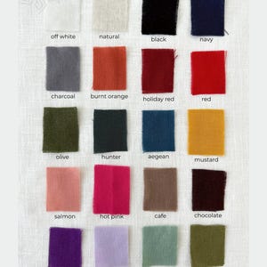 May include: Swatch card with 16 fabric samples in various colors, including off white, natural, black, navy, charcoal, burnt orange, holiday red, red, olive, hunter, aegean, mustard, salmon, hot pink, cafe, chocolate, purple, lavender, mint, and avocado.