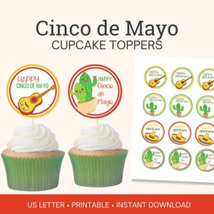 May include: Printable cupcake toppers for Cinco de Mayo. The toppers feature a guitar, cacti, and a sombrero. The text on the toppers reads "Happy Cinco de Mayo".