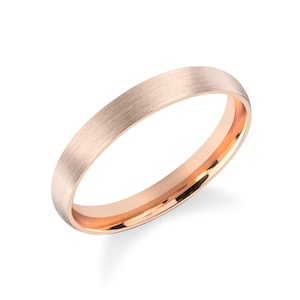 May include: A brushed rose gold wedding band with a polished inner edge.