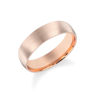 May include: A brushed rose gold wedding band with a polished inner edge.