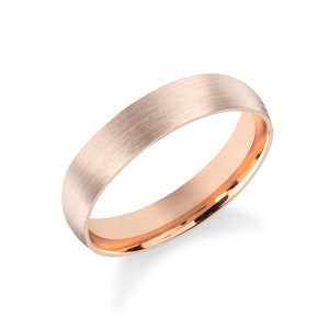 May include: A brushed rose gold wedding band with a polished inner edge.