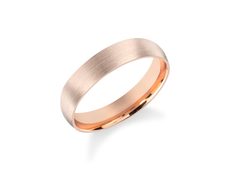 May include: A brushed rose gold wedding band with a polished inner edge.