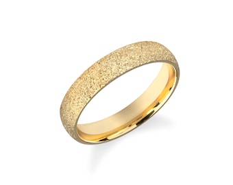 May include: A gold wedding band with a textured, hammered finish.