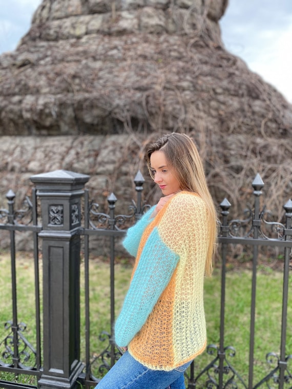 bright turquoise sweater