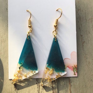 Handmade teal dangle triangle resin earrings with golden flakes. Gold plated ear hooks. Bespoke, unique, statement gift for her.