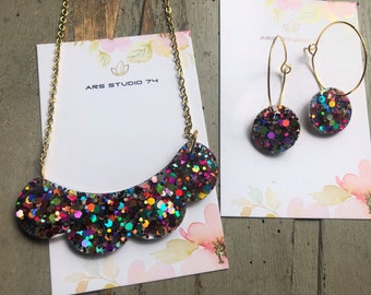 Handmade resin multicolour glitter black bib necklace and matching circle hoop earrings. Bespoke, statement, quirky jewellery for her.