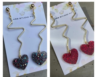 Handmade dangle glitter resin heart earrings on heartbeat golden connectors, on studs. Unique, bespoke gift