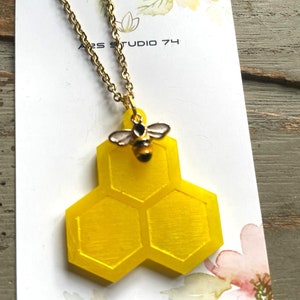 Handmade honeycomb resin necklace with bee charm. Unique, quirky jewellery, gift