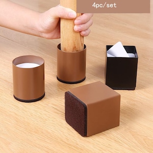 May include: Set of four brown furniture leg protectors. Two are round and two are square. The square protectors have a brown felt bottom. The round protectors have a black felt bottom. The text "4pc/set" is visible in the image.