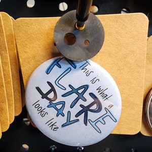 May include: A white button with blue text that reads "This is what a flare day looks like".