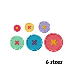 May include: Six colorful embroidered button designs in various sizes. The buttons are round with a white cross in the center.