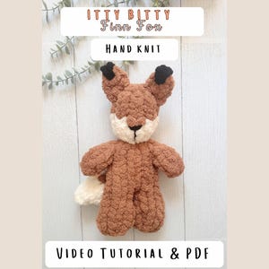 May include: A hand knit plush fox toy with brown and cream yarn, featuring black ear tips and a white tail tip. Text on the image reads: ITTY BITTY Finn Fox, HAND KNIT, and VIDEO TUTORIAL & PDF. The fox has a textured, soft appearance.