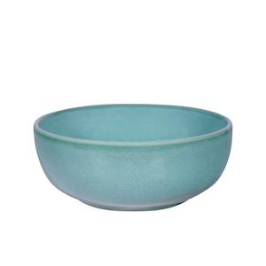 Peut inclure: Un bol en céramique bleu-vert avec une surface texturée. Le bol est rond et a un bord large.