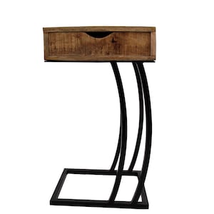 May include: A side table featuring a wooden drawer and a black metal frame. The drawer is crafted from light brown wood and has a curved handle. The frame has a distinctive design with curved legs and a rectangular base.