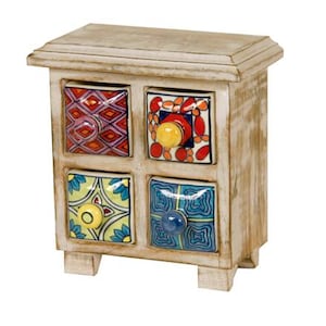 May include: A small, decorative wooden chest with four drawers. The chest is painted in a distressed white finish. Each drawer front features a colorful, patterned ceramic tile with a unique knob. The chest sits on short, square feet.