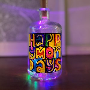 Happy Monday inspired hand painted, light up glass bottle