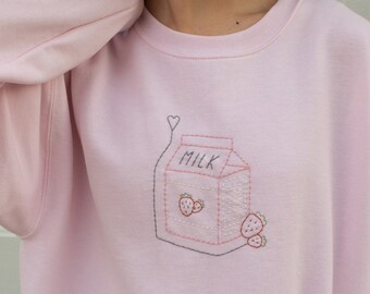 Hand-embroidered Strawberry Milk Crewneck Sweatshirt in Pale Pink