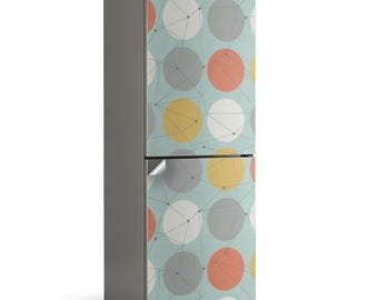 May include: A fridge with a light grey body and a patterned door wrap. The wrap has a light blue background with large circles in white, grey, yellow, and coral, connected by grey lines.