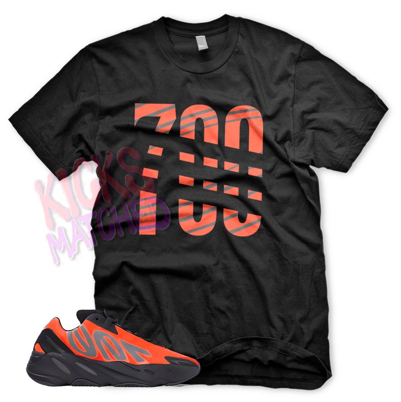 May include: Black t-shirt with a large orange "700" graphic and a pair of black and orange sneakers.