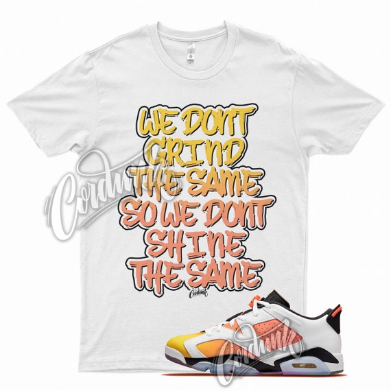 white and yellow jordan shirt