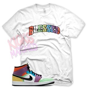 White " BLESSED ARCH " T Shirt to match Jordan 1 WMNS Lightbulb Multi Color Playground by Kicks Matched