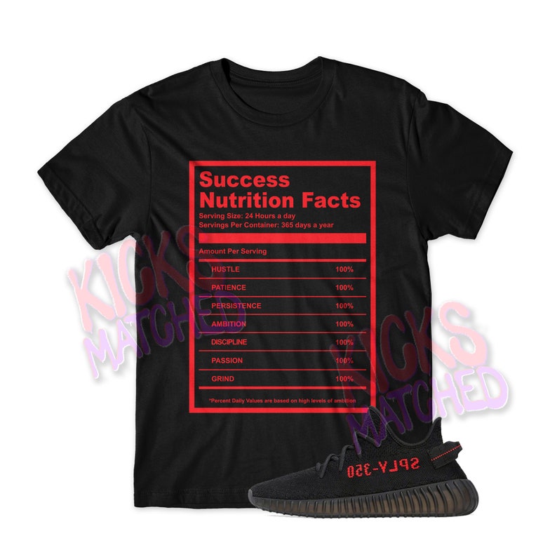May include: Black t-shirt with a red graphic that reads "Success Nutrition Facts" with a list of qualities needed for success, such as hustle, patience, persistence, ambition, discipline, passion, and grind. The t-shirt is paired with black and red sneakers.