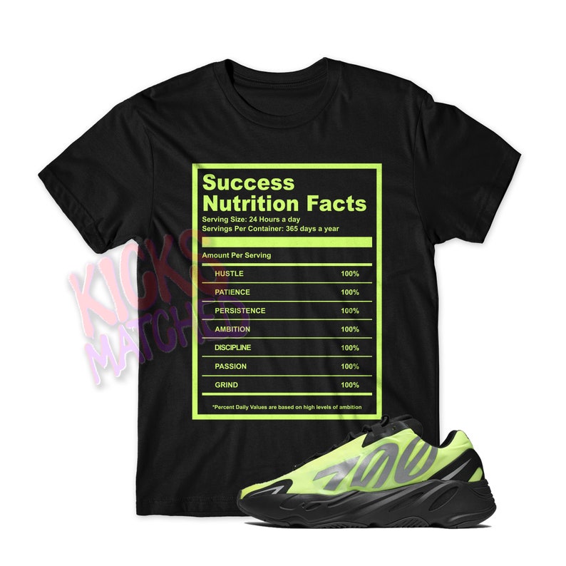 May include: Black t-shirt with a green nutrition facts label that says "Success Nutrition Facts" with the following ingredients: Hustle, Patience, Persistence, Ambition, Discipline, Passion, and Grind. Each ingredient is listed with 100%. The t-shirt is paired with black and neon green sneakers.