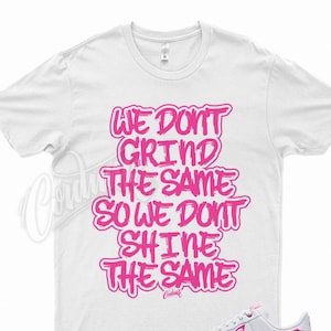 white and hot pink nike shirt