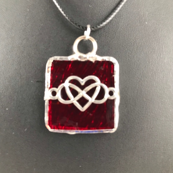 Red textured stained glass jewelry-square shaped pendant.  Elegant, handcrafted and lead-free. Item is a wearable stained glass piece of art