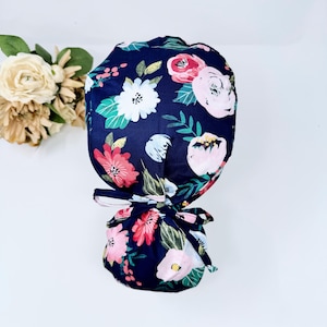 Floral ponytail scrub cap for women, Blue Scrub cap with ponytail holder and Satin Lined Option by Paradise Caps.