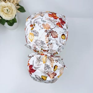 Fall Ponytail scrub cap, Thanksgiving Surgical Cap for women with satin lined by Paradise Caps. Fall Acorns And Leaves - print.