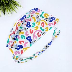 Gorro quirúrgico para hombre con diseño de perro. Divertido gorro quirúrgico con forro de satén y diseño de calavera, de Paradise Caps.