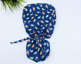 Dinosaur Toss Ponytail scrub cap, Surgical cap women. Satin Lined Option Surgical cap with ponytail.