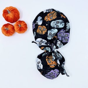Skull ponytail scrub cap for women. Halloween Surgical cap with satin lined. Scrub hat with ponytail by Paradise Caps.