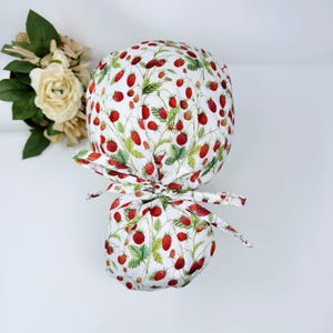 Strawberry Ponytail scrub cap for women. Spring floral Scrub hat for women with satin lined option by Paradise Caps. light mint.