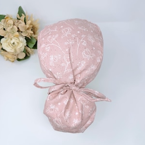 Floral ponytail scrub cap, satin lined option. Summer scrub cap with ponytail holder for women. Pink surgical scrub caps by Paradise Caps.