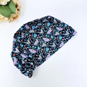 Midnight Butterfly Euro scrub cap for women. Floral European satin lined surgical cap by Paradise Caps. Dark navy blue.