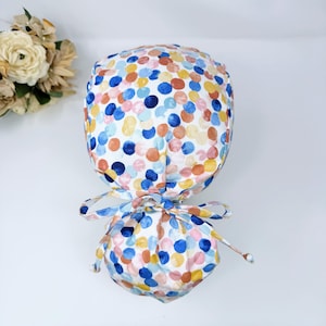 Ponytail scrub cap for women with satin lined option. Scrub hat with ponytail holder by Paradise Caps.