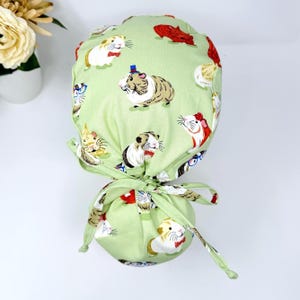 Guinea pig Ponytail scrub cap women. Pet Satin Lined Option Surgical cap with ponytail by Paradise Caps.
