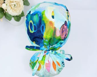 Women Ponytail scrub cap. Blue Satin Lined Option Surgical hat with ponytail by Paradise Caps. Solace Multi Color Circle - print.